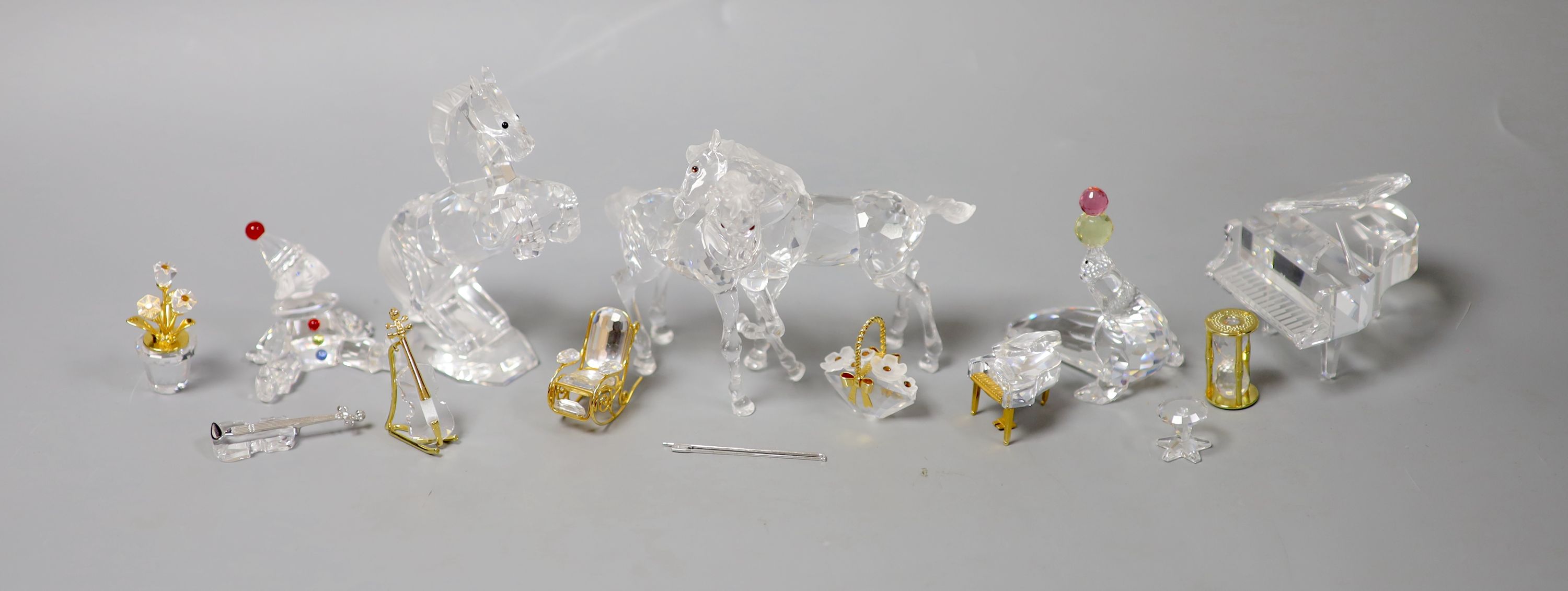 Thirteen Swarovski crystals including Pair of Horses and Seated Clown